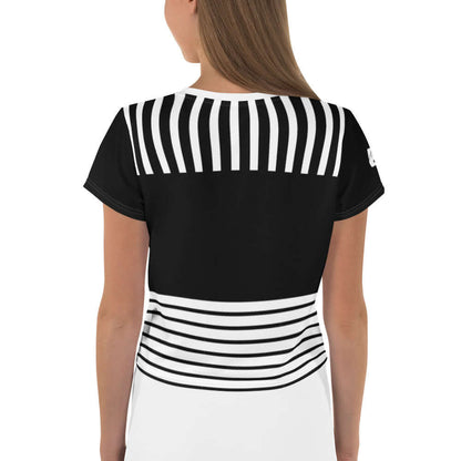 Back view of woman wearing Allover-Crop-T-Shirt N°1, featuring unique black and white striped design and modern crop fit.