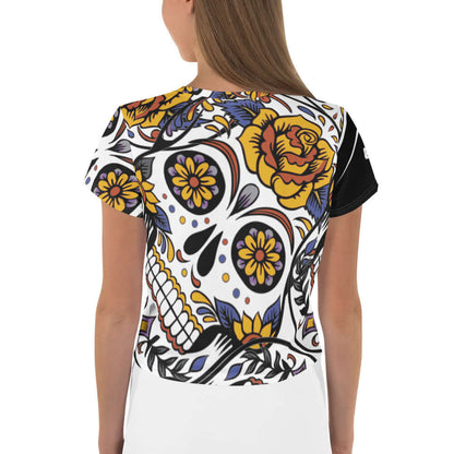 Person wearing Allover-Crop-T-Shirt N°4 with colorful skull and floral design, showcasing unique printed fashion style.