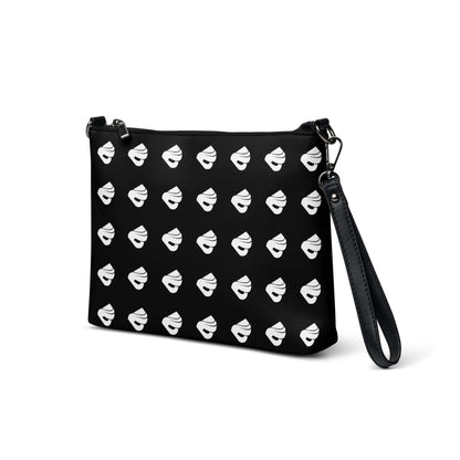 Stylish Umhängetasche N°0 in black with white pattern, featuring a detachable wrist and shoulder strap for versatile use.