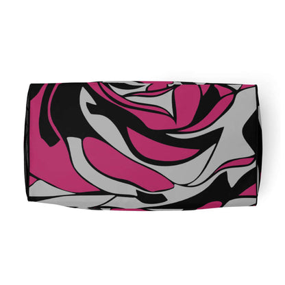 Colorful abstract pattern on rectangular fabric design with black, pink, and grey swirls.