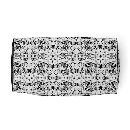 Black and white patterned Weekender N°9 bag, ideal for travel, errands, and gym with adjustable padded straps and multiple pockets.
