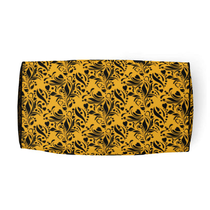 Floral patterned yellow and black decorative cloth with intricate design elements.