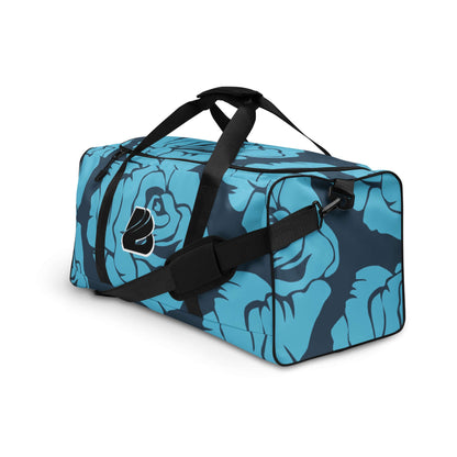 Blue floral Weekender N°19 with black straps, perfect for travel, errands, and gym, featuring multiple pockets and adjustable shoulder straps.