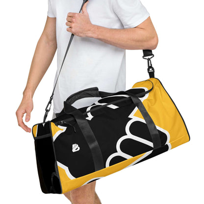 Man carrying Weekender N°24 travel bag with adjustable strap, featuring ample storage and stylish design for daily use and gym visits.