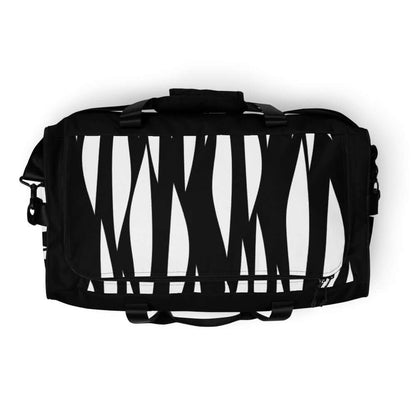 Weekender N°3 black and white patterned travel bag with adjustable shoulder straps and multiple pockets for convenience.