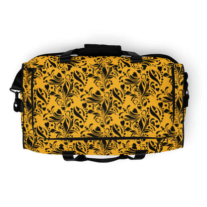 Weekender N°11 yellow duffle bag with black floral pattern, adjustable padded shoulder straps, and ample storage space.