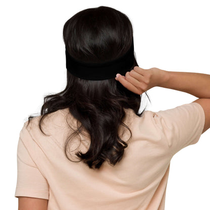 Back view of woman wearing Stirnband N°2, a stretchy, stylish headband for comfort during workouts or casual outings.