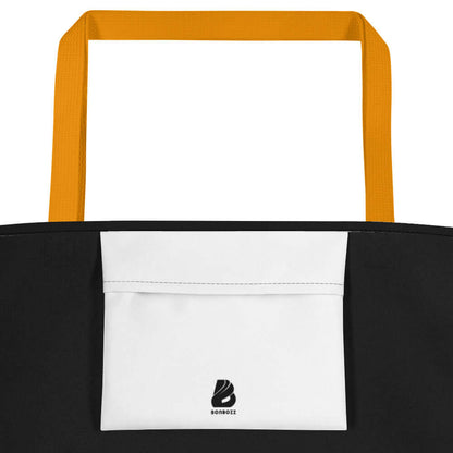 Strandtasche N°0 with orange handles and a large front pocket, made from durable polyester, perfect for beach outings.