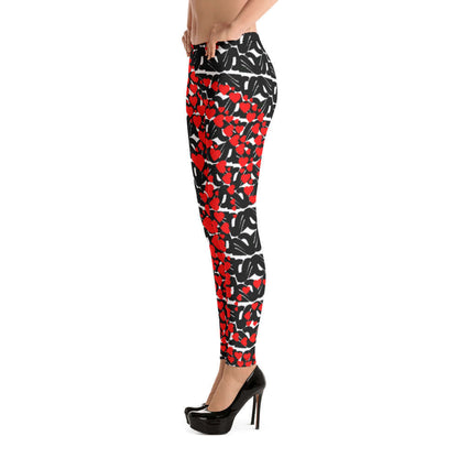 Alt Tag: Side view of Leggings N°0 in a red and black abstract pattern, highlighting stylish design and durability.