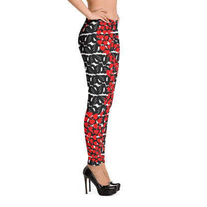 Side view of stylish Leggings N°0 featuring a red and black pattern, made from stretchable microfiber for comfort and durability.