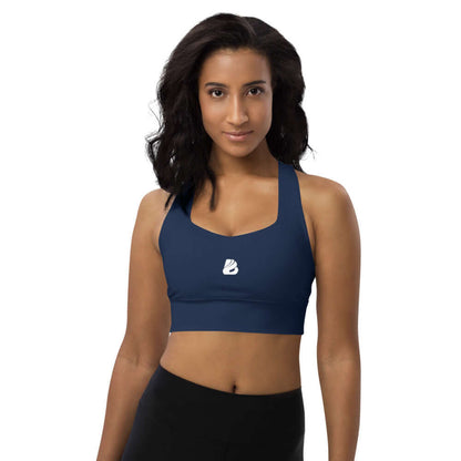 Longline-Sport-BH N°0 in navy blue, modeled by a woman, designed for comfort and support during workouts or as stylish streetwear.