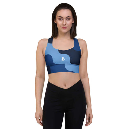 Woman modeling Longline-Sport-BH N°1 with blue camouflage design for sports and streetwear fashion.