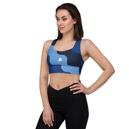 Woman wearing Longline-Sport-BH N°1 in a blue camo pattern, ideal for sports like jogging or gym workouts, styled as activewear.