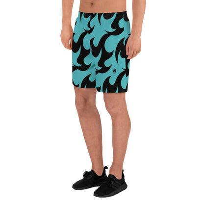 Model wearing Lange Allover-Sport-Shorts für Herren N°0, ideal for fitness; pattern features black and turquoise design on longer shorts.