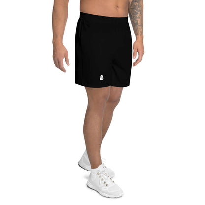 Man wearing Lange Allover-Sport-Shorts für Herren N°1, black, ideal for fitness activities with four-way stretch and water-repellent fabric.