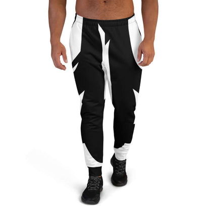 Mann trägt Herren-Jogginghose N°1 aus Baumwollmischung, ideal für Training und Entspannung, Schwarz-Weiß-Design, eng anliegend.