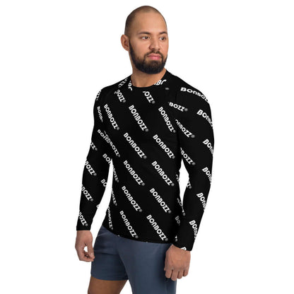 Man wearing Herren-Rash-Guard N°25, black with white text pattern, long-sleeve, provides protection from sun and wind, perfect for sports.
