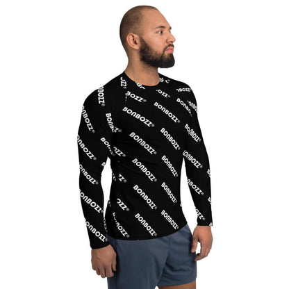 Man wearing Herren-Rash-Guard N°25 with black and white BONBOZZ pattern, long sleeves for sun protection, ideal for sports.
