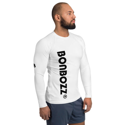 Man wearing Herren-Rash-Guard N°28, white long-sleeve with black text, ideal for protection against sun, wind, and sand. Polyester fabric.