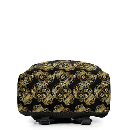 Black backpack with gold skull pattern print seen from the side, featuring multiple decorative skull designs.