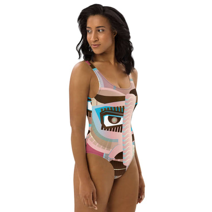Model wearing colorful Einteiliger Badeanzug N°18 with abstract design, showcasing flattering fit and smooth fabric for beach or pool.