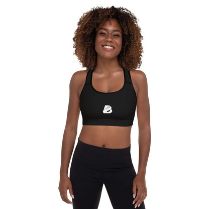 Woman wearing Gepolsterter Sport-BH N°2, black padded sports bra for workouts with moisture-wicking fabric and removable pads.