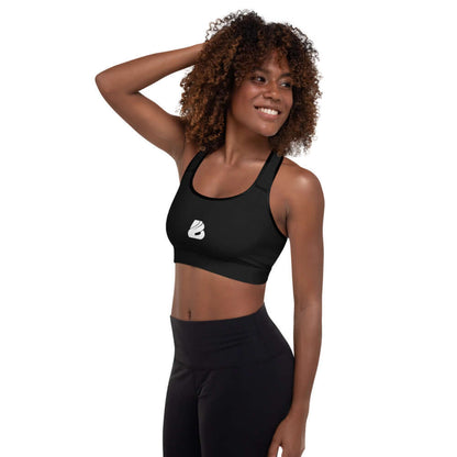 Woman wearing Gepolsterter Sport-BH N°2 for workouts, showing comfort and support with moisture-wicking fabric and removable padding.