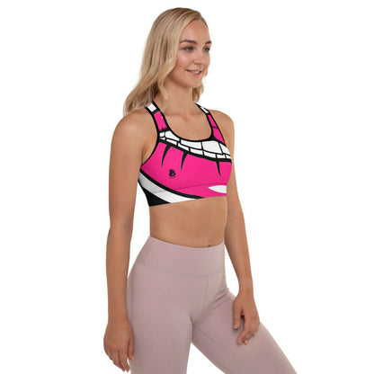 Woman wearing Gepolsterter Sport-BH N°1, pink workout top with black straps for high support.