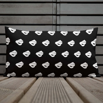 Premium-Kissen N°0 with black and white pattern on wooden surface, adding luxury and style to any room.