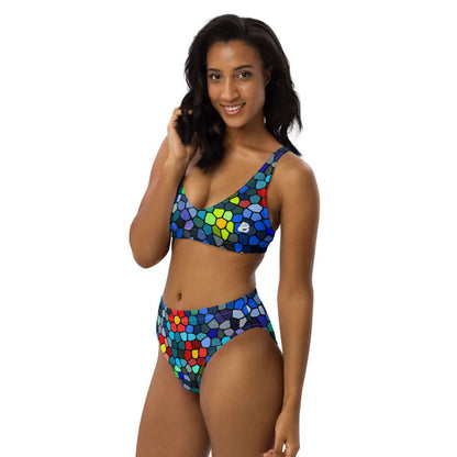 Model wearing High Waist Bikini N°0 with colorful geometric design, featuring removable pads and double-layer fabric for beach comfort.