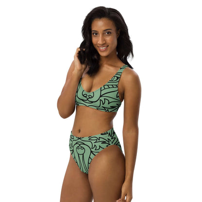 Model wearing Recycelter Allover High Waist Bikini N°0 in green with black print, featuring removable padding and double-layer fabric.