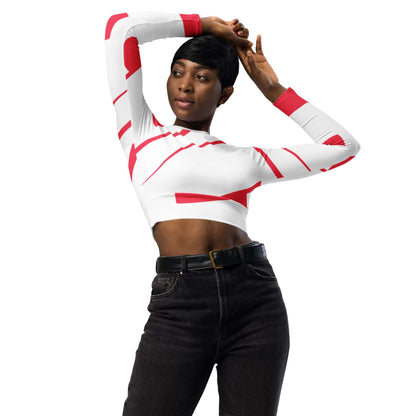 Model wearing Recyceltes Langarm Crop Top mit Allover-Druck N°1, featuring red and white design, eco-friendly material, and comfortable fit.