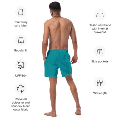 Man wearing Herren-Badehosen N°10 showcasing features like pockets, elastic waistband, and UPF 50+ protection; eco-friendly fabric highlighted.