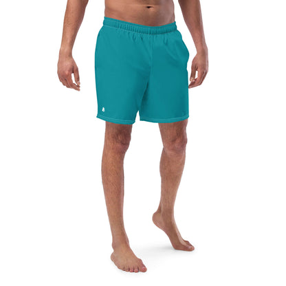 Man wearing Herren-Badehosen N°10 turquoise swim shorts with quick-dry and breathable fabric