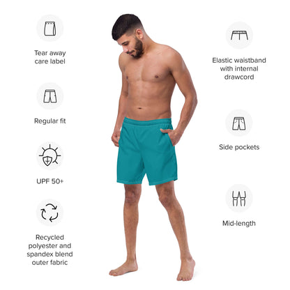 Male model wearing Herren-Badehosen N°10, showcasing teal swim shorts with elastic waistband and side pockets, highlighting quick-dry features.