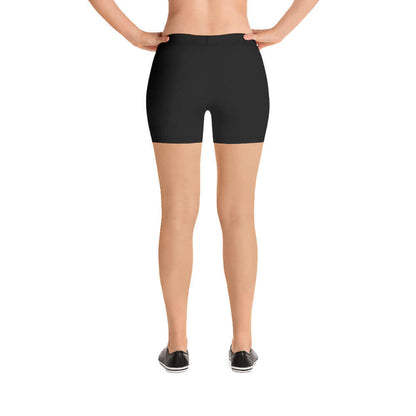 Back view of black, four-way stretch Shorts N°0 on model, showcasing polyester-elastane blend for comfort and fit.