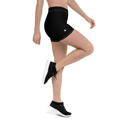 Person wearing black Shorts N°1 with four-way stretch material, side view showing comfort and fit.