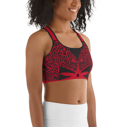 Sport-BH N°2 in red-black pattern, moisture-wicking, supportive straps, double-layer front, worn by a woman in workout.