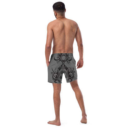 Man wearing Herren-Badehosen N°0 swim shorts with black abstract design, rear view