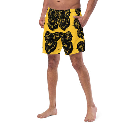 Model wearing Herren-Badehosen N°6 in yellow with black print, featuring quick-drying and breathable fabric with multiple pockets.