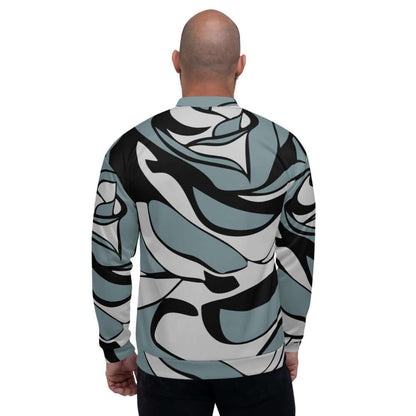 Person wearing patterned Unisex Bomberjacke N°18 viewed from the back, featuring abstract black and teal design with a fleece interior.