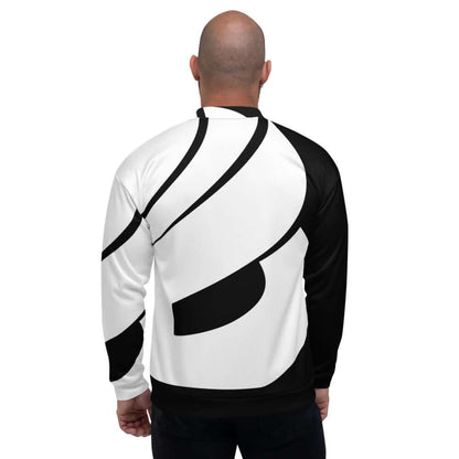 Model wearing Unisex Bomberjacke N°31 with abstract black and white design, showcasing fleece interior and loose fit, back view.