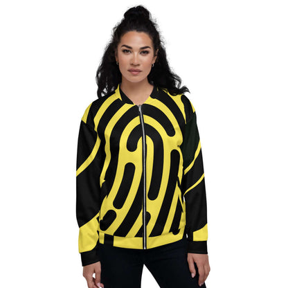 Model wearing Unisex Bomberjacke N°5 in black and yellow abstract pattern, showcasing trendy design and unisex fit.
