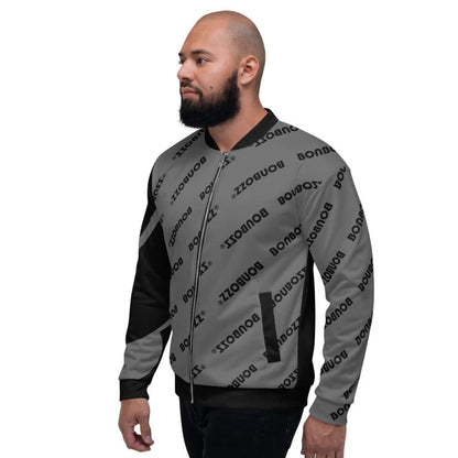 Man wearing Unisex Bomberjacke N°9 with all-over print and relaxed fit, versatile for layering over T-shirts and hoodies.
