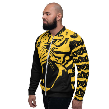 Man wearing Unisex Bomberjacke N°28 with yellow and black design, showing side view with unique graphic print.