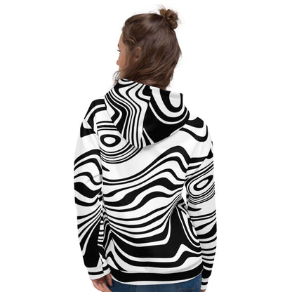 Model wearing Unisex-Kapuzenpullover N°42 with black and white abstract pattern, showing back view.