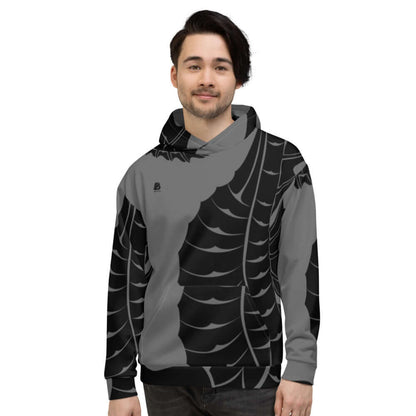 Model wearing Unisex-Kapuzenpullover N°15 with vibrant print, indoors.