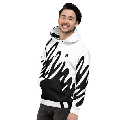 Smiling person wearing Unisex-Kapuzenpullover N°26 with bold black and white print, featuring a soft brushed fleece interior.