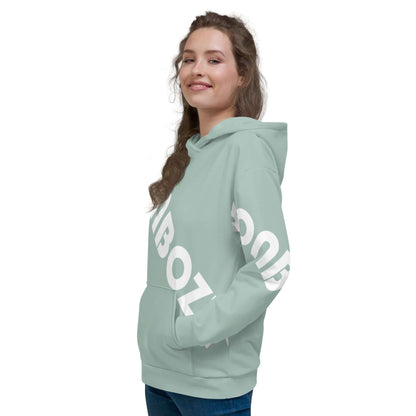 Young woman wearing a stylish mint green Unisex-Kapuzenpullover N°41, featuring bold white text on sleeves and a comfortable fit.