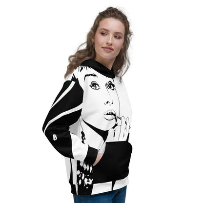 Person wearing Unisex-Kapuzenpullover N°8 with artistic black-and-white print, looking to the side against a white background.